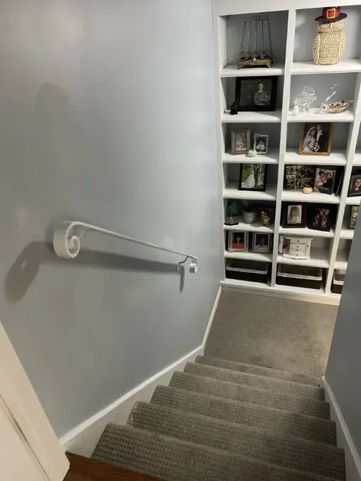 grey stairs with steel handrail