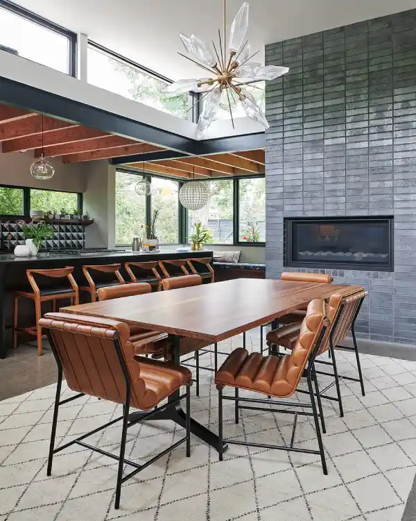 industrial dining room table and chairs with fireplace