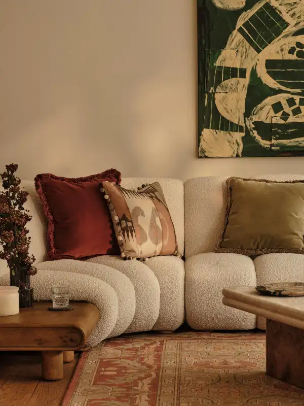 2024 living room trends - cozy sofa cushions