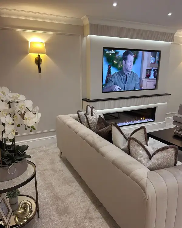 taupe living room with modern fireplace and TV