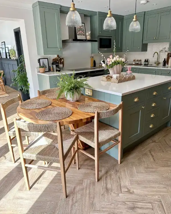 Dark green country kitchen and wood dining table