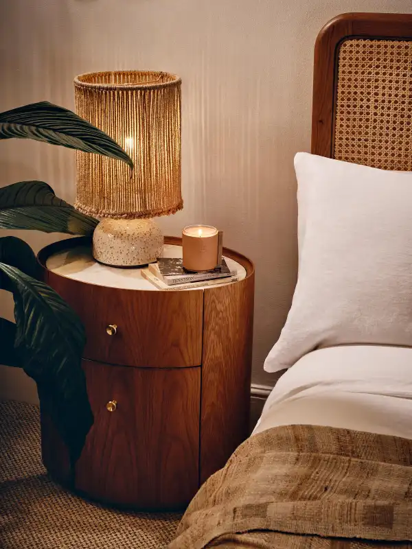 round bedside table with drawers for storage