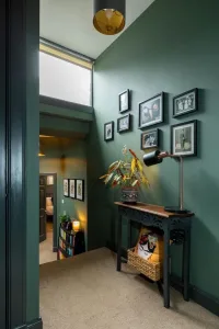 Farrow & Ball green smoke used in a hallway with black console table