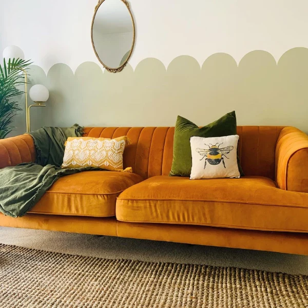 dulux overtly olive living room with orange and gold decor