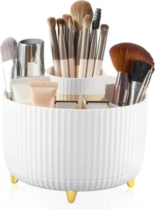 white circular make up brush and make up pot holder