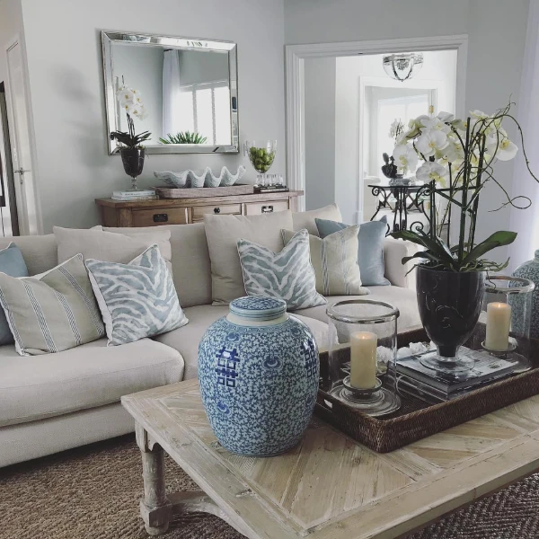 modern living room country aesthetic using duck egg blue decor in a grey lounge