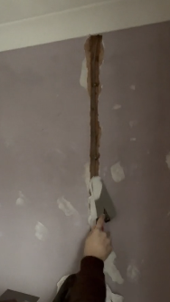 applying plaster to a wall