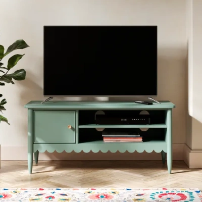 green tv stand with scallop design living room