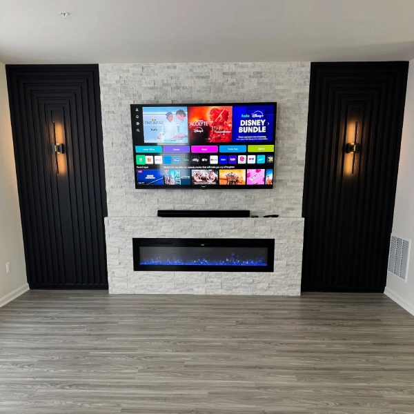 brick accent wall fireplace in living room with TV