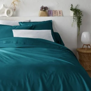 teal bedding for a beige bedroom