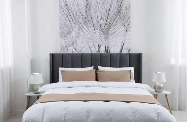 grey bedroom with grey divan bed with panel headboard